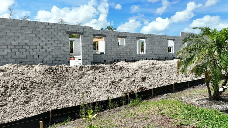 Block: Reinforced block walls rising, from the ground.