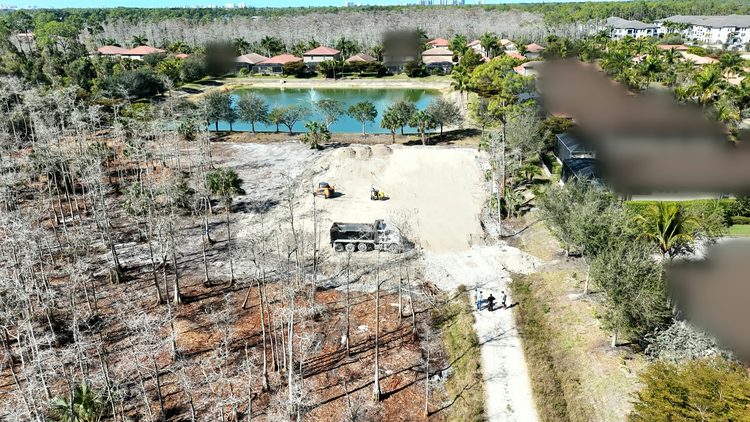 Site work: Fill brought in and the pad built up on a wooded lot.