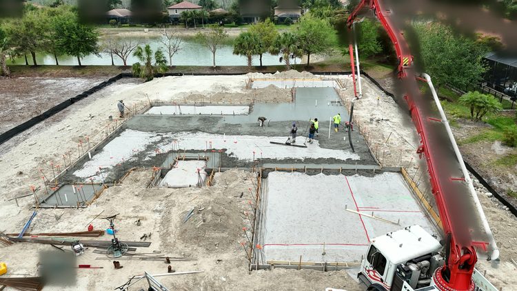 Slab: The slab pour, with the pump boom over the forms.