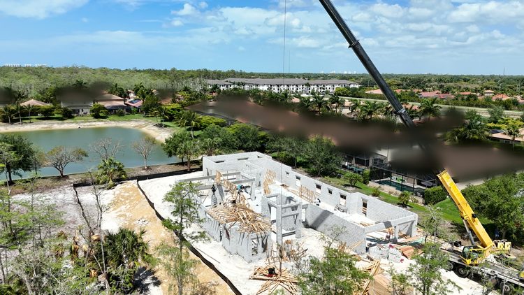 Trusses: Roof trusses set by crane.