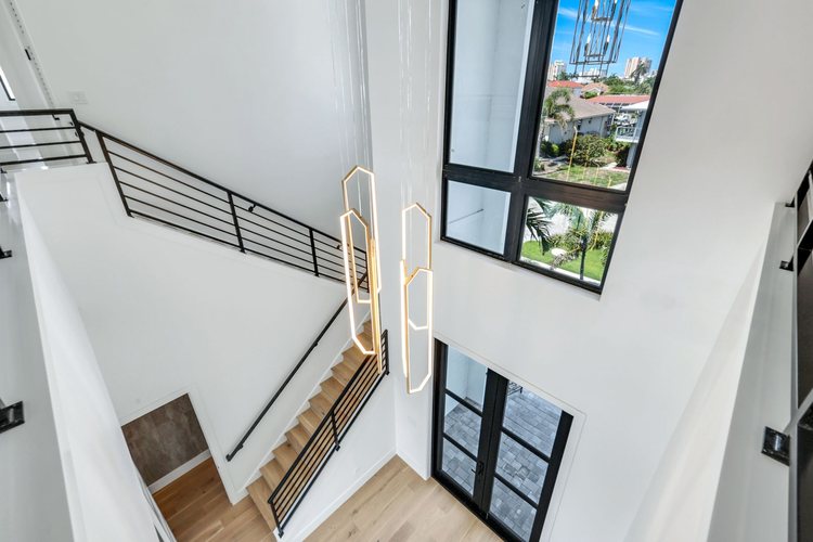 Two-story foyer and stair.